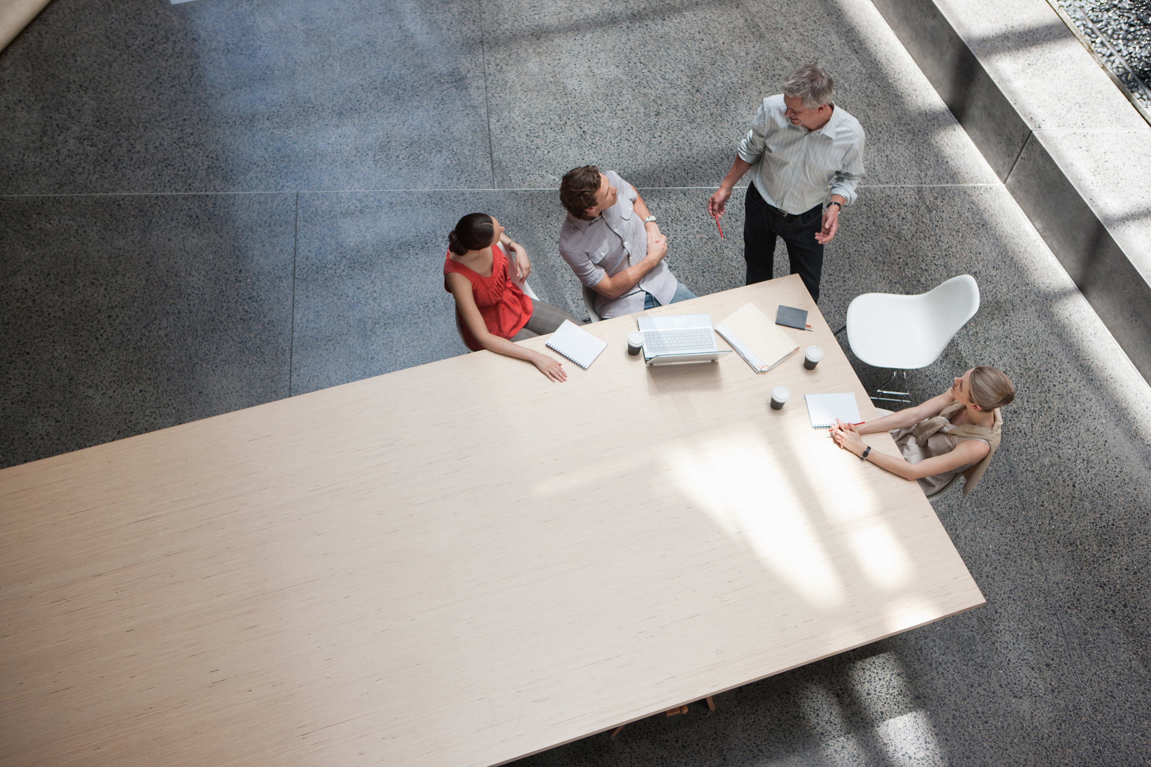 Birds eye view of people collaborating in work environment